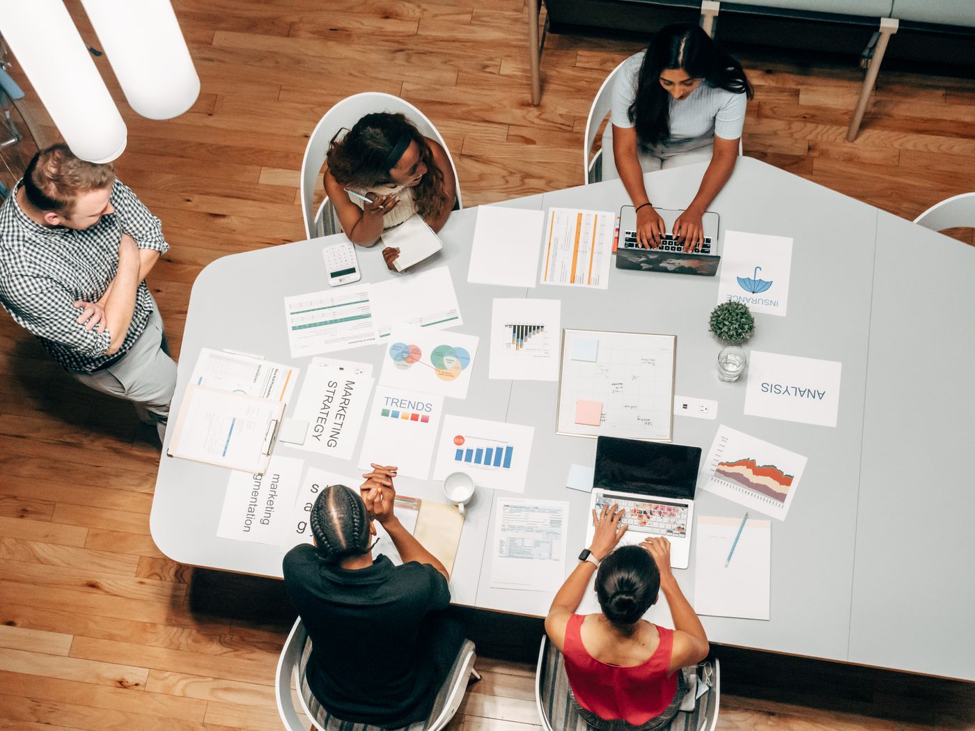 Writer at desk preparing AI industry analysis